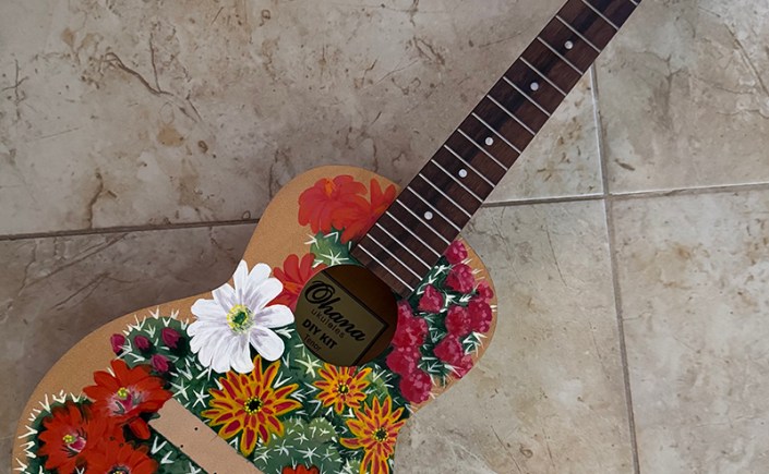 Custom painted ukulele with desert blooms. Original artwork by Marie Hughey.